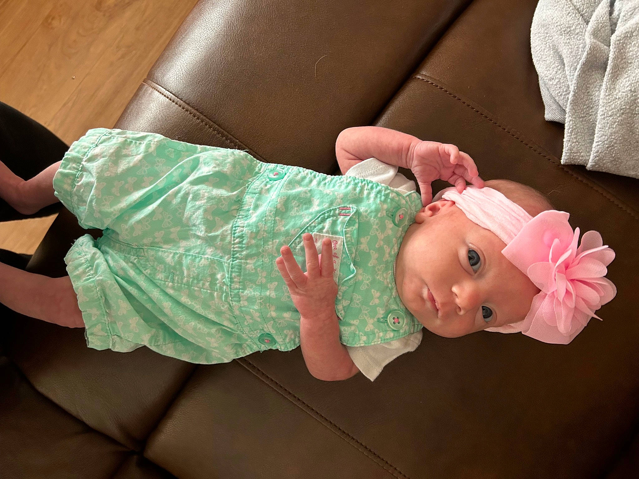 Maddie is registered to the contest to win money with this photo: baby, baby_products, baby_toddler_clothing, cheek, child, comfort, costume, dress, fashion_accessory, hat, human_leg, magenta, person, pink, room, skin, sleeve, sock, thigh, toddler