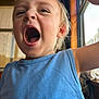 child, indoor, blue_shirt, cap, window, natural_light, closeup, yawning, shouting, face, expression, young_child, pixelated_design, sleeveless_shirt, hand_raised, light, wood, casual_clothing, person, daylight