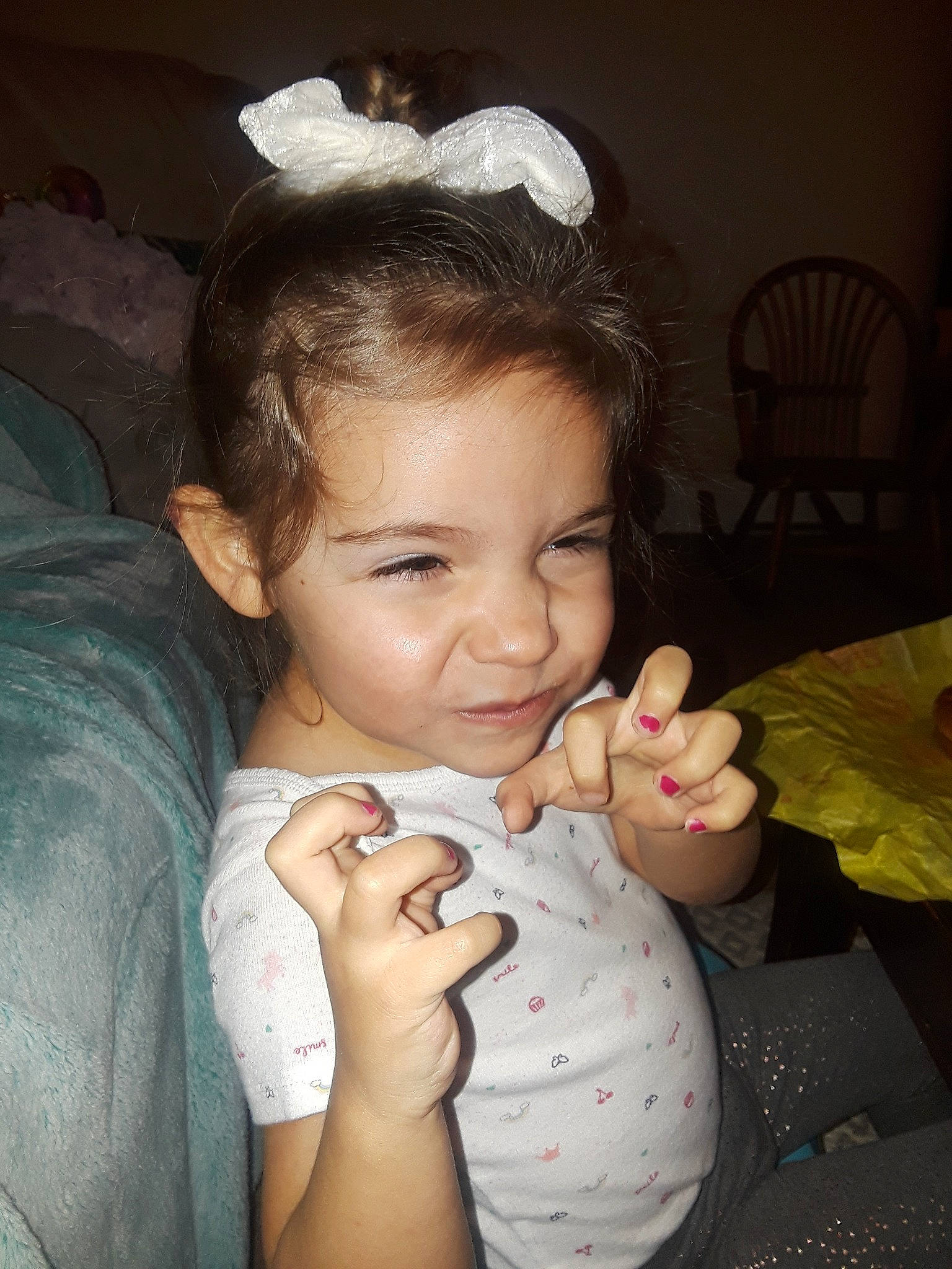 Emmalee is registered to the contest to win money with this photo: baby, brown_hair, cheek, child, ear, eating, eye, face, finger, gesture, hand, mouth, nail, nose, person, skin, smile, snapshot, tableware, thumb