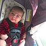 Elodie joined the competition — help win amazing prizes! baby, infant, car_seat, red_clothing, straps, face, tongue_out, indoors, seat, child, safety, cute, person, newborn, expression, soft_light, floral_pattern, fabric, head, hands
