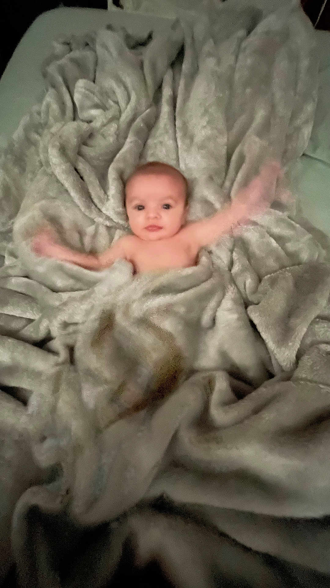 Ayden joined the competition — help win amazing prizes! baby, blanket, arms, waving, soft, cozy, curious, face, infant, child, texture, fabric, wrapped, bed, comfort, cute, young, motion_blur, skin, lying_down