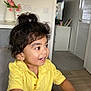 cabinet, carpet, child, curly_hair, door, flowers, furniture, hair_bun, happy, indoor, light_switch, person, room, smile, table, television, toddler, vase, yellow_shirt
