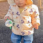 Nived joined the competition — help win amazing prizes! blue_jeans, casual, child, cute, daylight, expression, fence, footwear, gravel, hood, jacket, nature, outdoor, park, person, playful, toddler, toy, walking, young_child