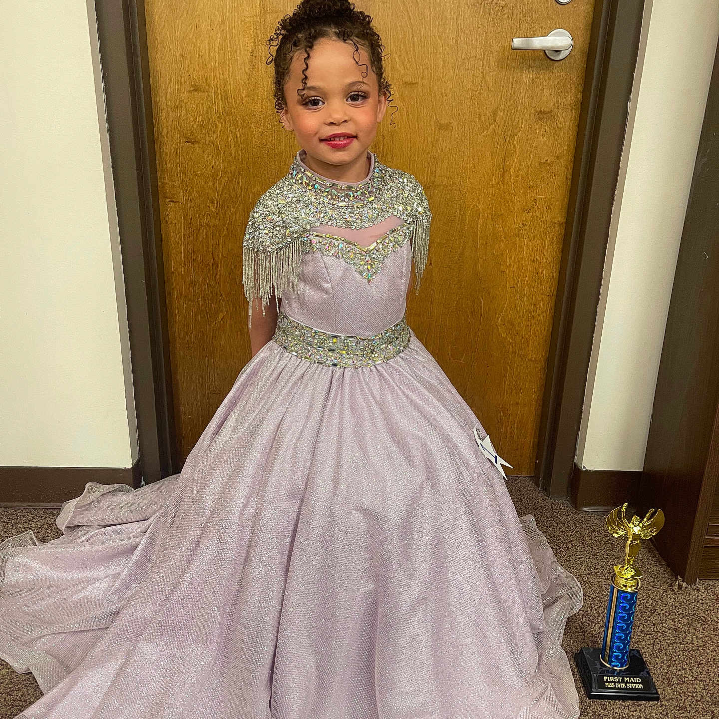 Kaliann joined the competition — help win amazing prizes! award, carpet, celebration, child, curly_hair, door, dress, fashion, girl, gown, happy, indoor, portrait, proud, room, smile, sparkly, standing, trophy, young