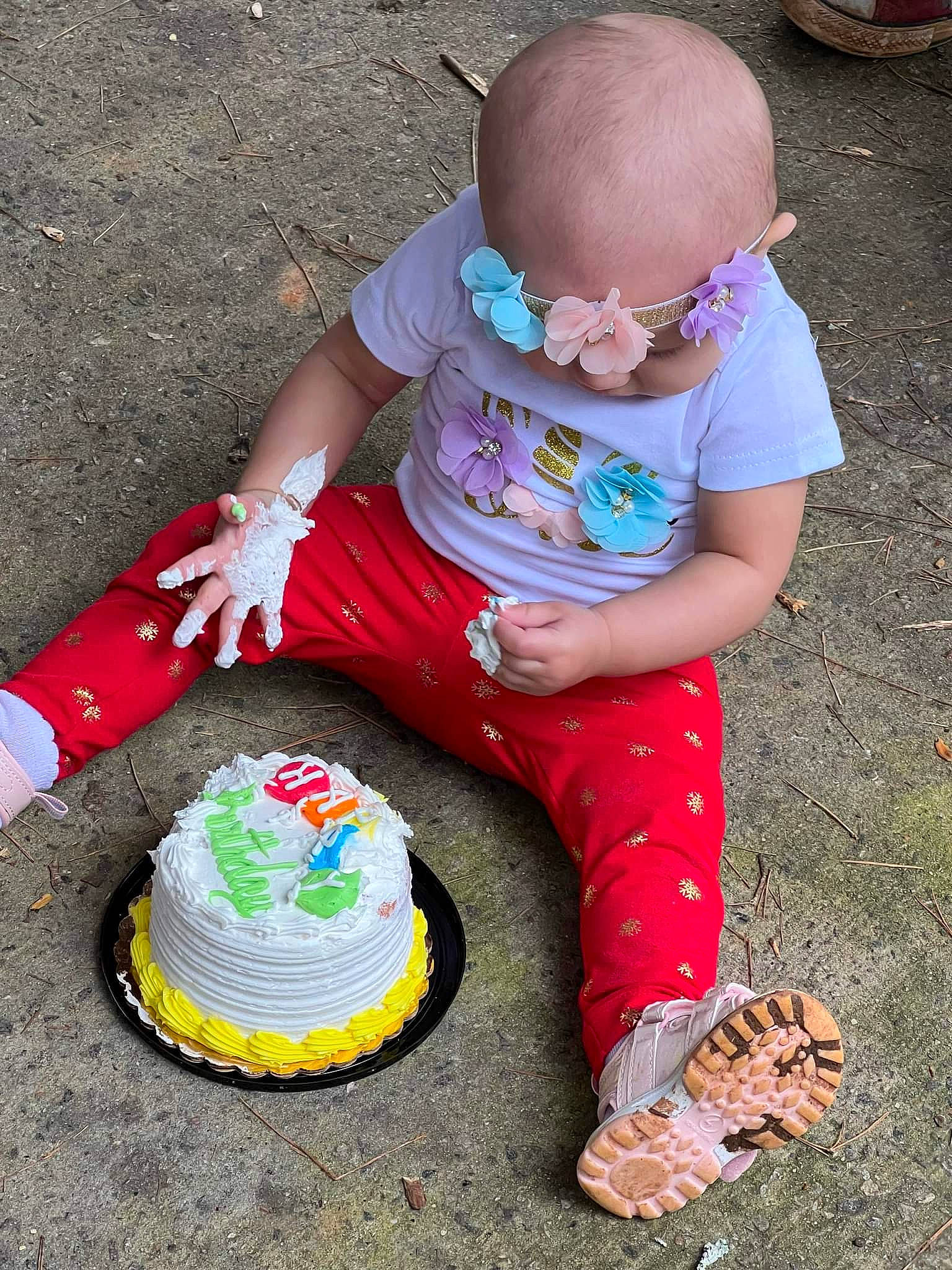 Aubree is registered to the contest to win money with this photo: baby, baby_toddler_clothing, birthday_cake, child, costume_hat, event, eyewear, fun, goggles, grass, hat, icing, leisure, person, pink, play, sitting, soil, sugar_cake, sunglasses