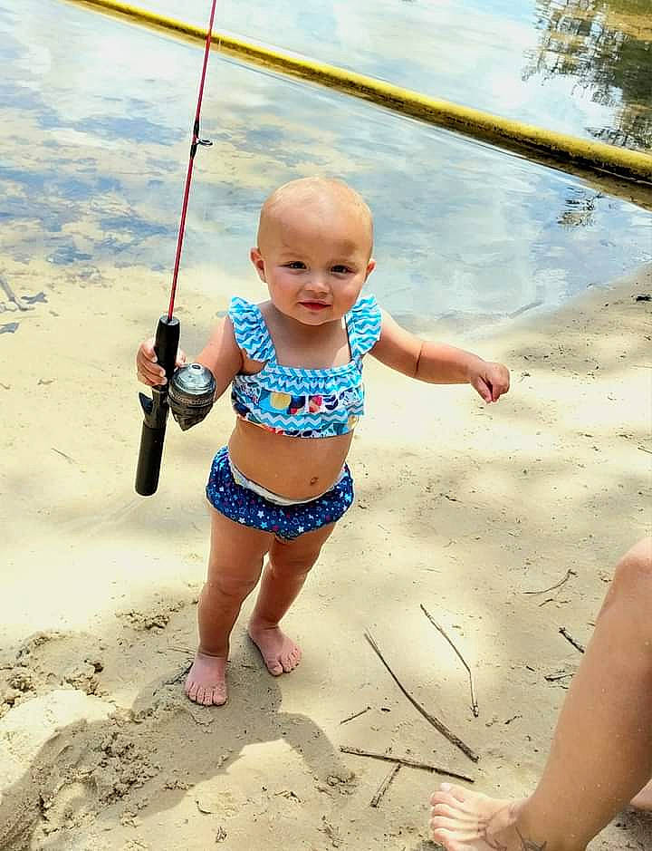 Aubree is registered to the contest to win money with this photo: baby, baby_toddler_clothing, barefoot, beach, body_of_water, city, electric_blue, foot, fun, happy, human_leg, leisure, people_in_nature, people_on_beach, person, recreation, sand, summer, swing, toddler