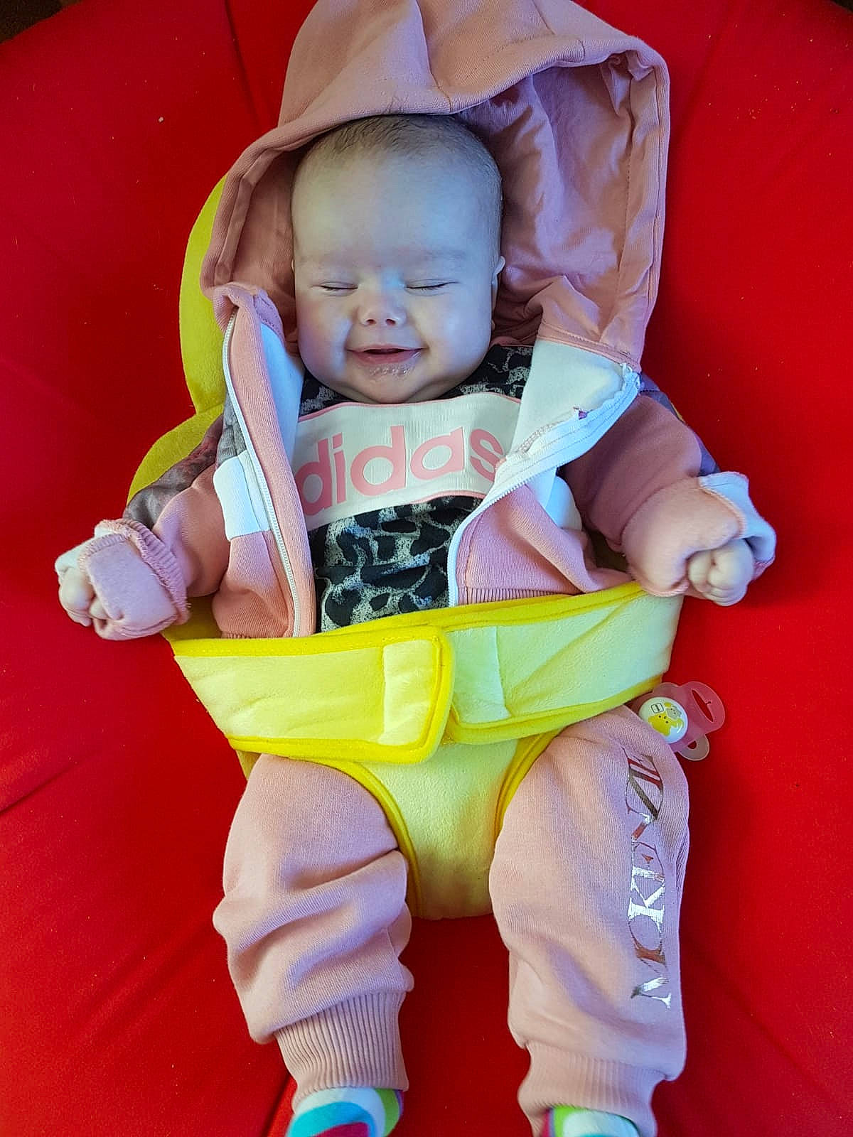 Ella-mai is registered to the contest to win money with this photo: baby, cheek, child, fun, joy, person, play, product, sitting, skin, smile, toddler, yellow