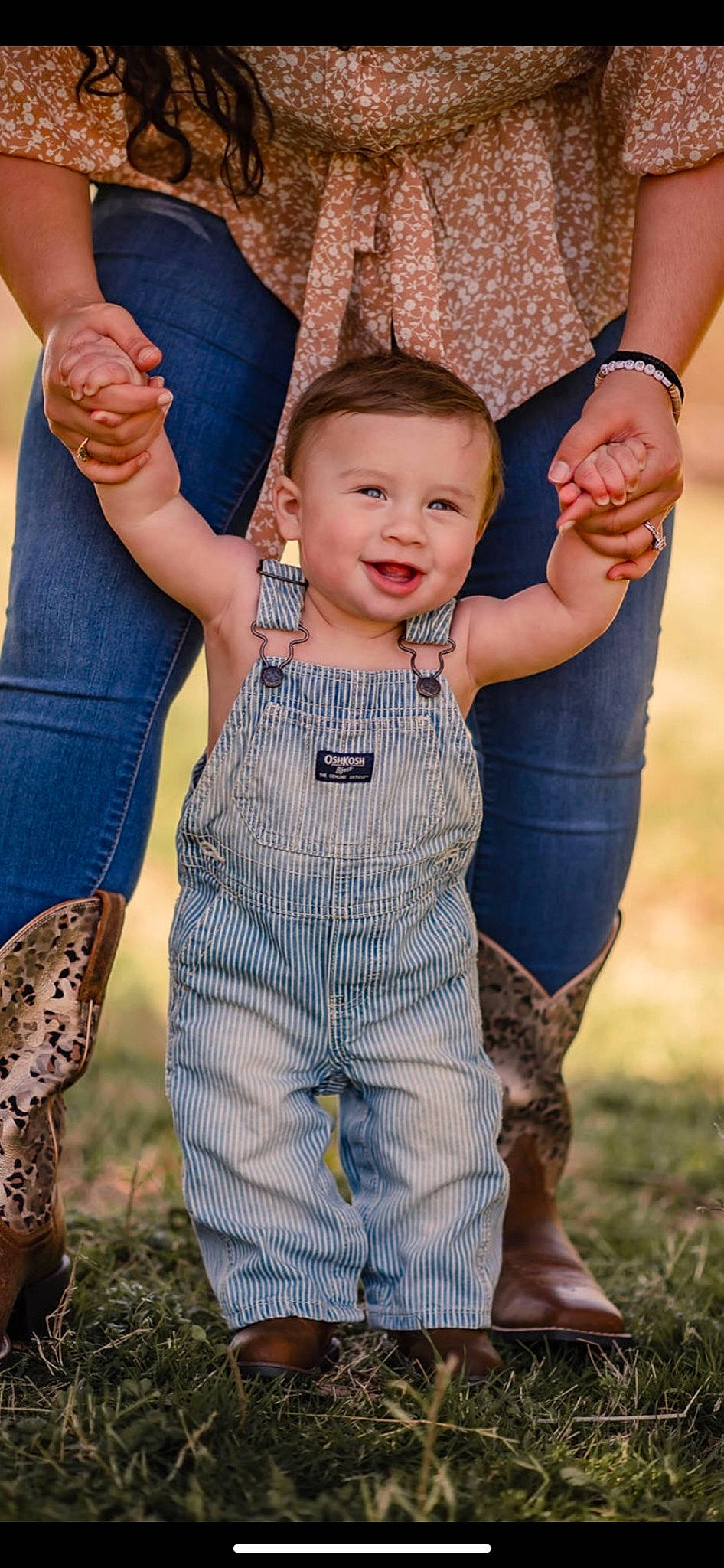 Chandler is registered to the contest to win money with this photo: arm, baby, baby_toddler_clothing, eye, fun, gesture, grass, hand, happy, head, joy, people_in_nature, person, photograph, sleeve, smile, standing, textile, thumb, toddler