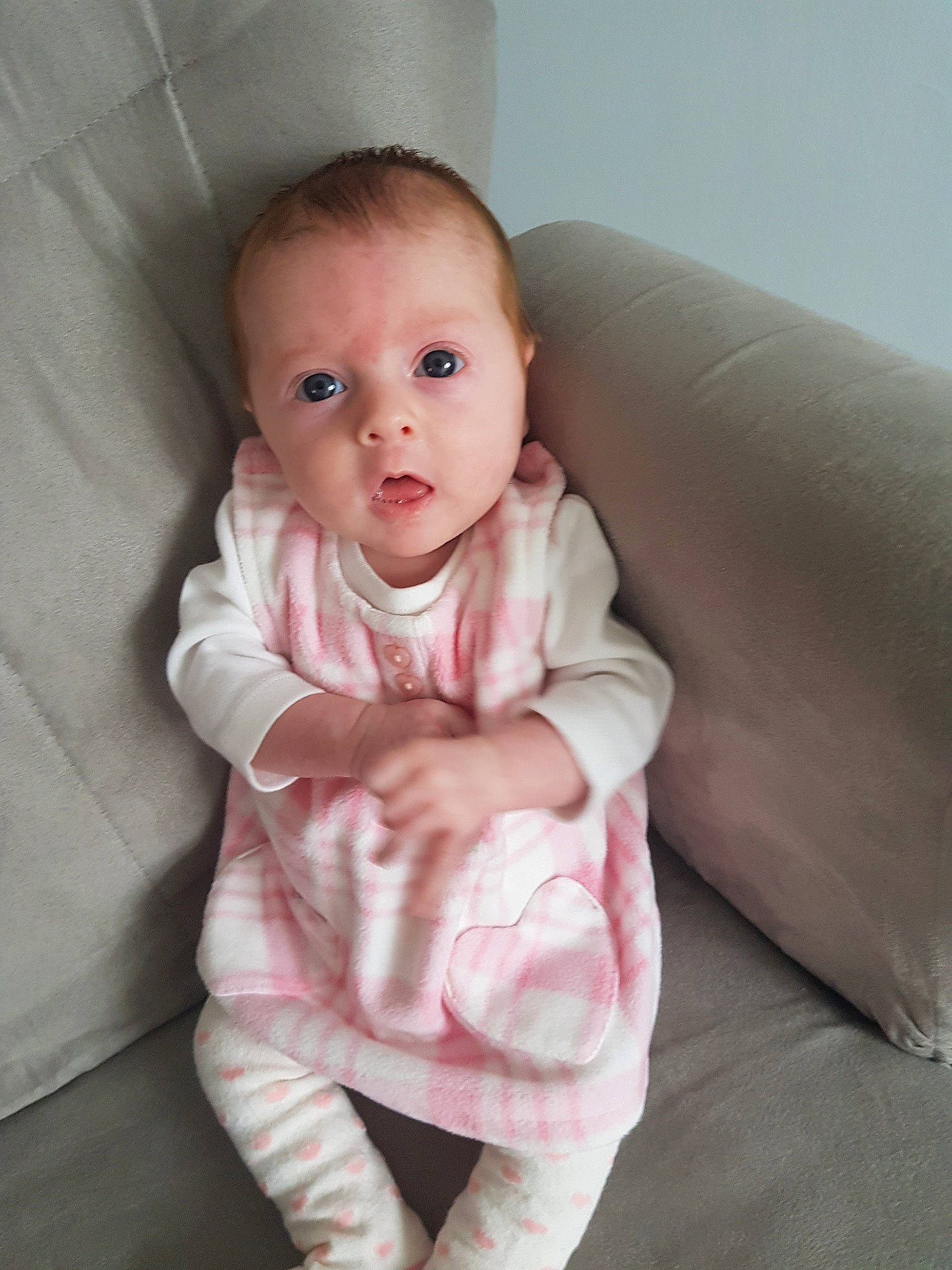 Evie-mae joined the competition — help win amazing prizes! baby, cheek, child, eye, face, head, linens, lip, person, pink, sitting, skin, sleeve, smile, surprise, toddler