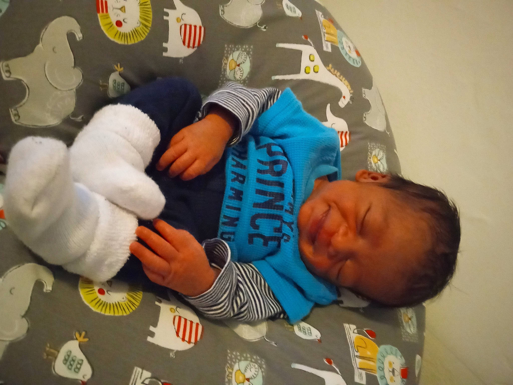 Cameron is registered to the contest to win money with this photo: art, baby, baby_products, baby_sleeping, baby_toddler_clothing, bedtime, child, comfort, hand, linens, nap, orange, person, play, room, sitting, sleep, sleeve, t_shirt, textile