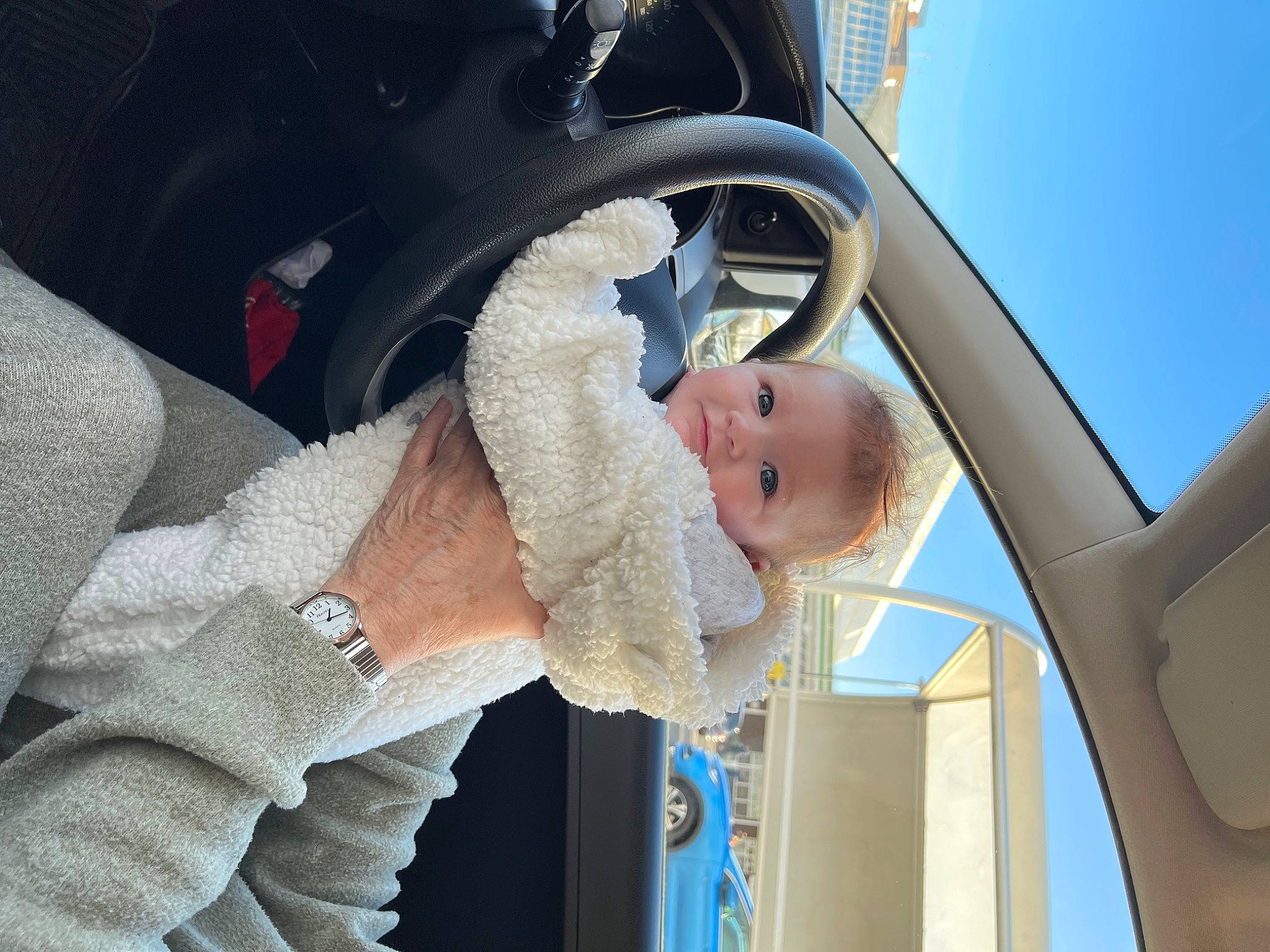 Ayla-rose is registered to the contest to win money with this photo: automotive_exterior, automotive_lighting, baby, car_seat, comfort, dress, gesture, hand, happy, hat, motor_vehicle, outerwear, person, product, sky, smile, steering_wheel, toddler, vehicle_door, wheel