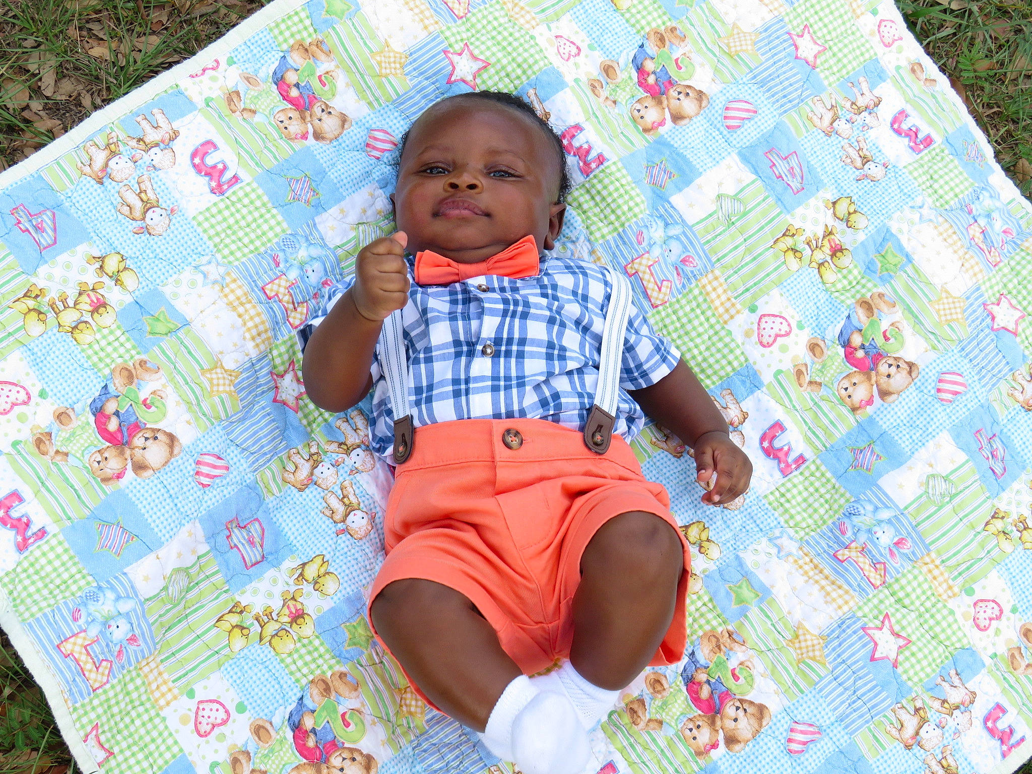 Daniel is registered to the contest to win money with this photo: baby, baby_toddler_clothing, child, comfort, fun, grass, happy, head, leaf, leisure, linens, magenta, pattern, person, pink, product, purple, sleeve, t_shirt, textile