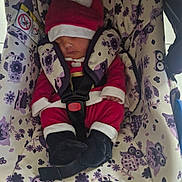 Kayla a rejoint le concours — aidez-le/la à gagner de superbes lots ! baby, car, car_interior, carseat, clothing, coat, cushion, face, furniture, glove, hat, head, homedecor, jacket, person, photography, portrait, purple, transportation, vehicle