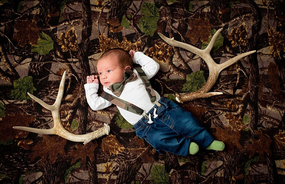 Beckett is registered to the contest to win money with this photo: adaptation, baby_toddler_clothing, branch, deciduous, fawn, flash_photography, forest, grass, human_body, leaf, organism, people_in_nature, person, plant, terrestrial_plant, toddler, trunk, twig, vertebrate, wood