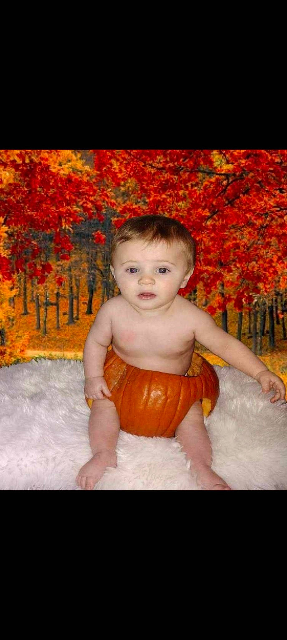 Ryland is registered to the contest to win money with this photo: abdomen, baby, chest, child, dress, eye, flash_photography, grass, hair, happy, leisure, orange, peach, people_in_nature, person, plant, sitting, toddler, tree, trunk