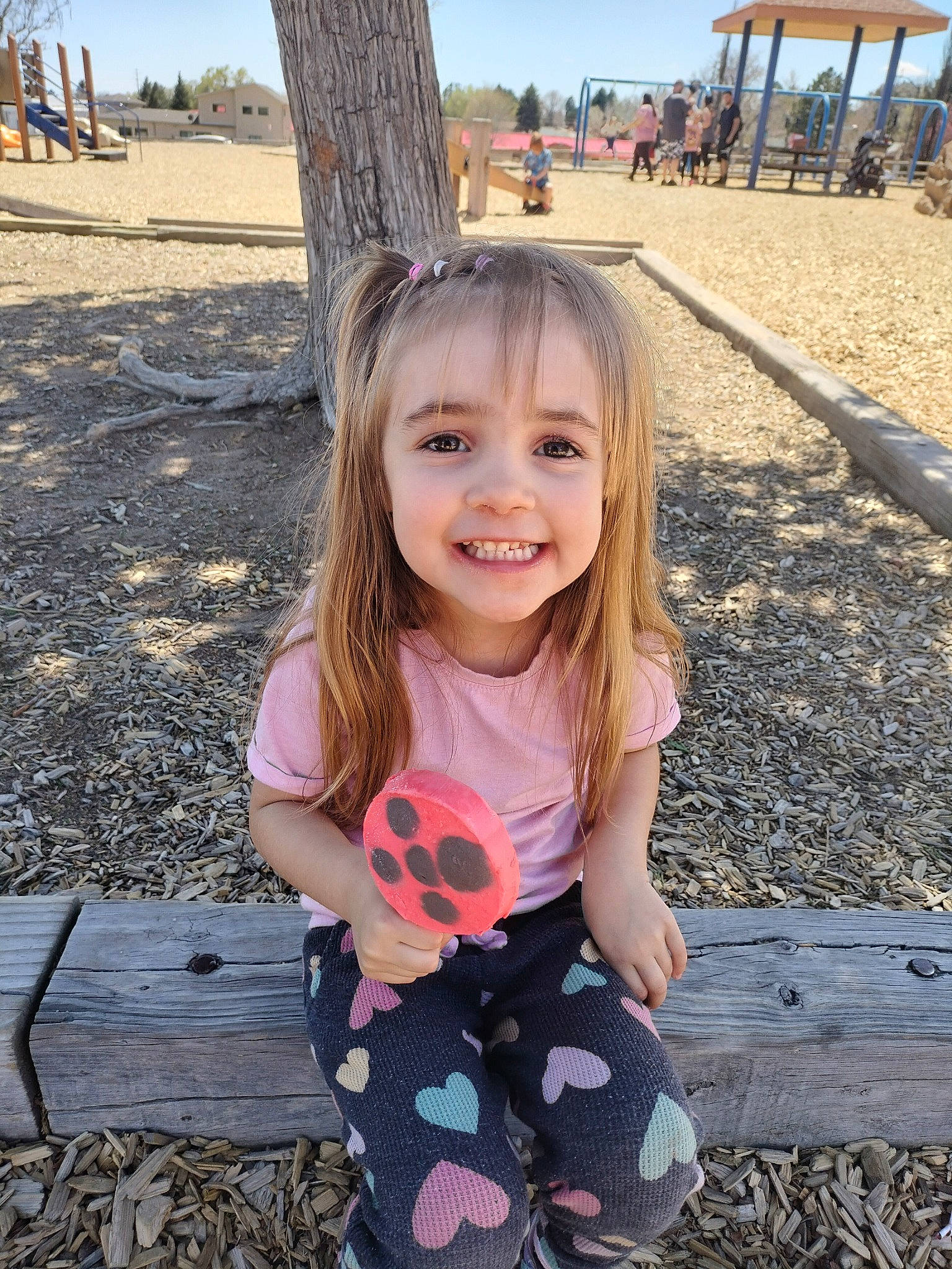 Scarlett is registered to the contest to win money with this photo: baby_toddler_clothing, dress, eye, fun, grass, happy, joy, leaf, leisure, people_in_nature, person, photograph, plant, public_space, sky, sleeve, smile, summer, tree, white