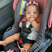 Kalina is registered to the contest to win money with this photo: baby, child, car_seat, pink_bows, plush_toy, sucking_fingers, floral_outfit, car_interior, safety_harness, cute, portrait, infant, seatbelt, adorable, child_safety, toy, person, young_child, car_door, bracelet
