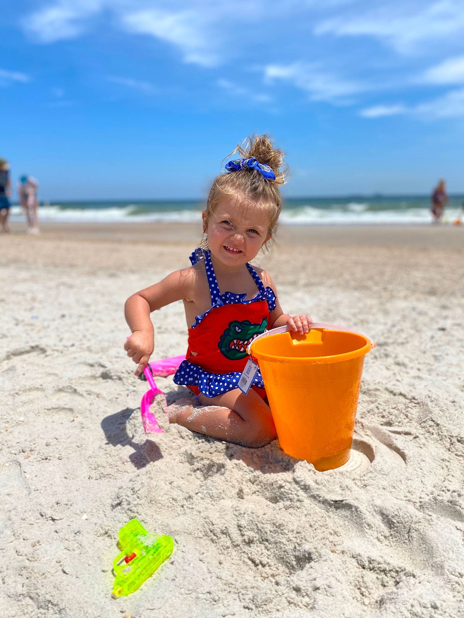 Summerlee is registered to the contest to win money with this photo: beach, bucket, child, cloud, fun, happy, hat, holiday, horizon, leisure, people_in_nature, people_on_beach, person, recreation, shore, sitting, sky, swimwear, toddler, travel