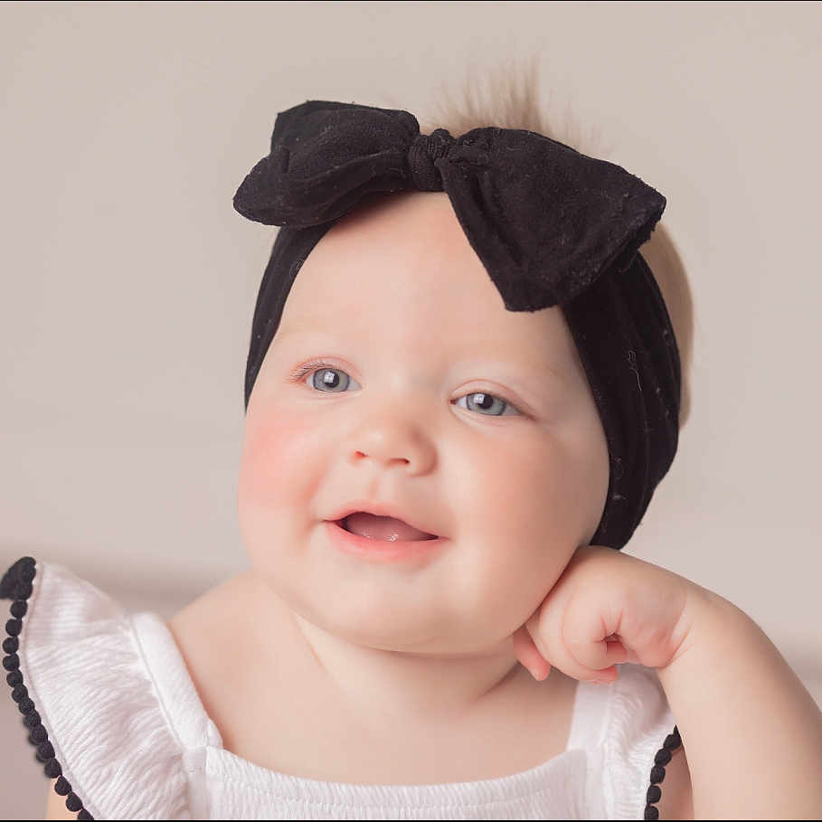 Harper is registered to the contest to win money with this photo: accessories, baby, babylaughing, bodypart, bonnet, cap, clothing, face, finger, formalwear, hand, happy, hat, head, headband, newborn, person, photography, portrait, smile