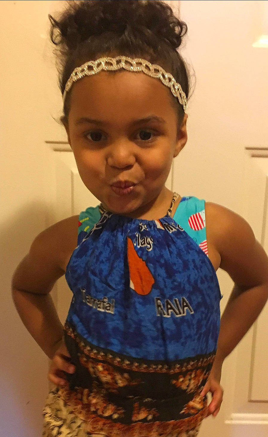 Paris is registered to the contest to win money with this photo: black_hair, child, face, fashion_accessory, forehead, hair, hair_accessory, hairstyle, head, headband, headgear, headpiece, person, skin, toddler