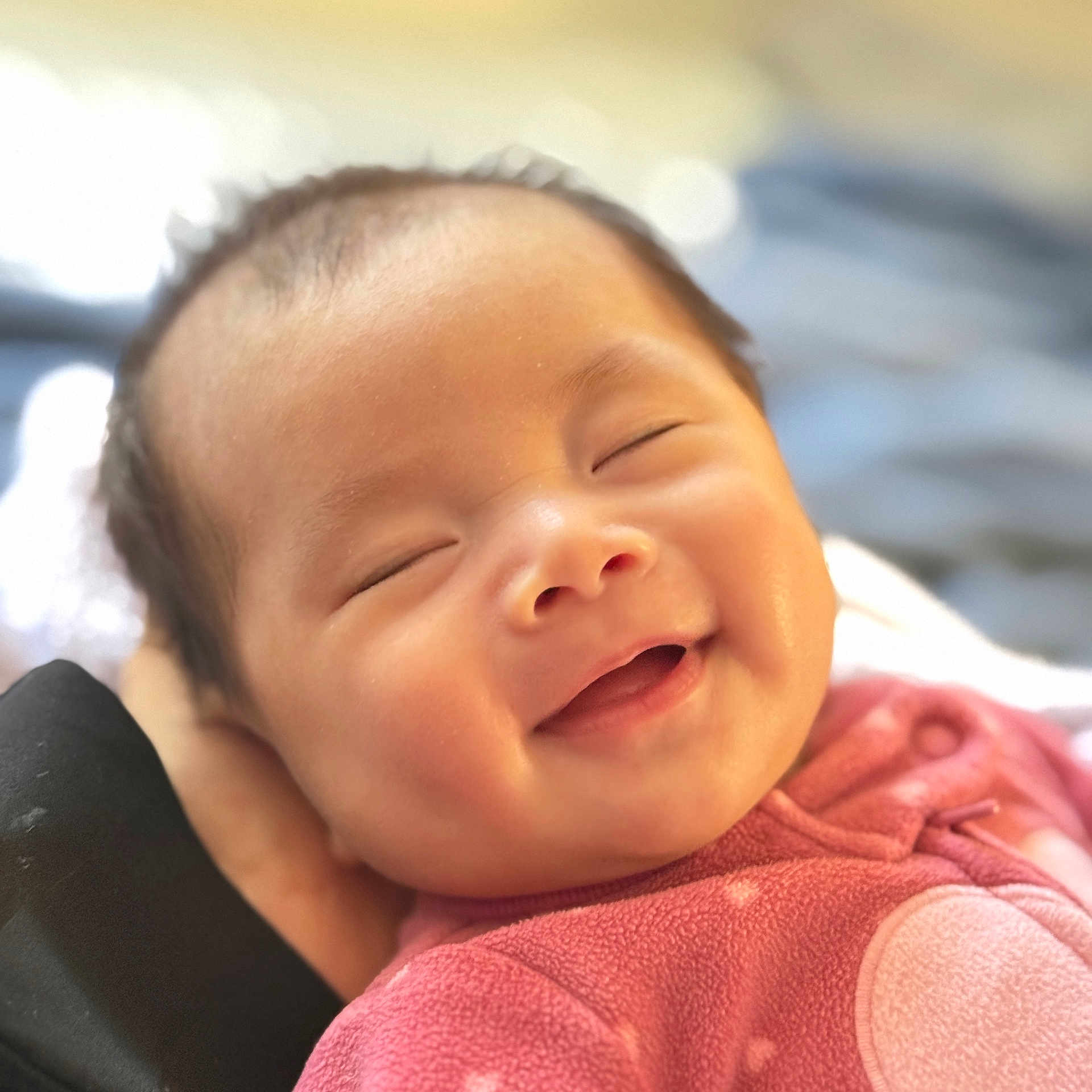 Anly joined the competition — help win amazing prizes! newborn, baby, infant, sleeping, yawning, face, portrait, close_up, smiling, closed_eyes, pink_clothing, onesie, cradled, indoors, soft_lighting, cozy, blanket, head, skin, photography