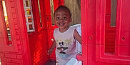 Jaylen is registered to the contest to win money with this photo: child, cute, daylight, door, fun, happy, mickey_mouse, outdoor, person, plastic, play, playhouse, red, smiling, sunlight, tank_top, toddler, window, wooden_floor, young