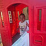 child, toddler, smiling, playhouse, red, plastic, outdoor, sunlight, mickey_mouse, tank_top, happy, door, window, wooden_floor, play, cute, person, daylight, fun, young