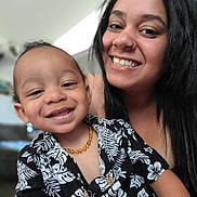 Jaylen joined the competition — help win amazing prizes! amber_necklace, black_hair, blurred_background, casual_clothing, child, close_up, cute, face, family, floral_shirt, happy, indoor, joy, nose_ring, people, portrait, skin, smiling, toddler, woman