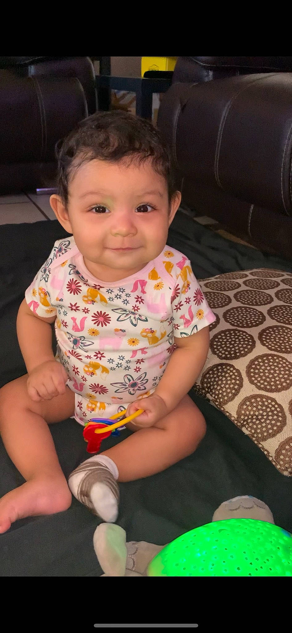 Jazmine is registered to the contest to win money with this photo: arm, baby, baby_toddler_clothing, black, cheek, chin, eye, face, finger, green, happy, head, human_body, iris, joy, lip, mouth, nose, person, skin