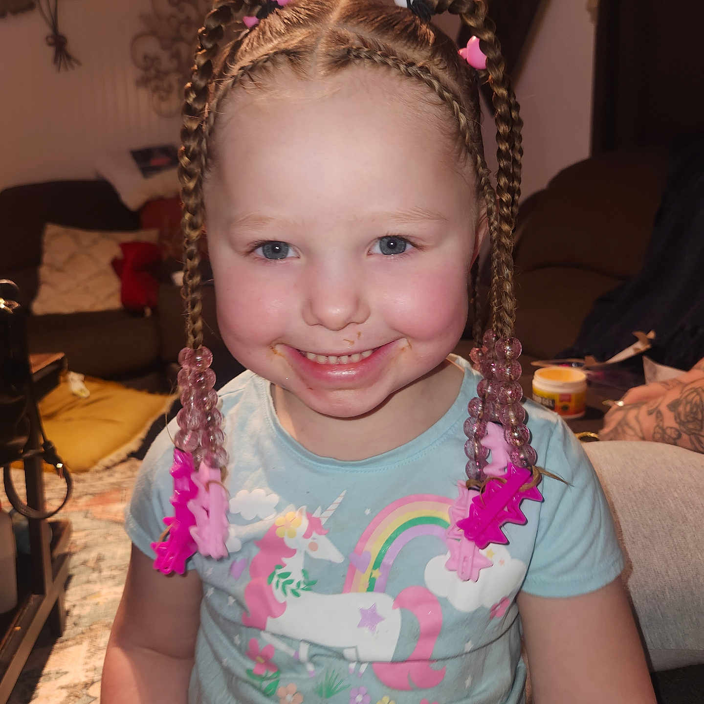 Cambria is registered to the contest to win money with this photo: architecture, baby, balloon, braid, building, clothing, couch, face, furniture, hair, head, homedecor, indoors, livingroom, person, photography, portrait, room, t_shirt, tape