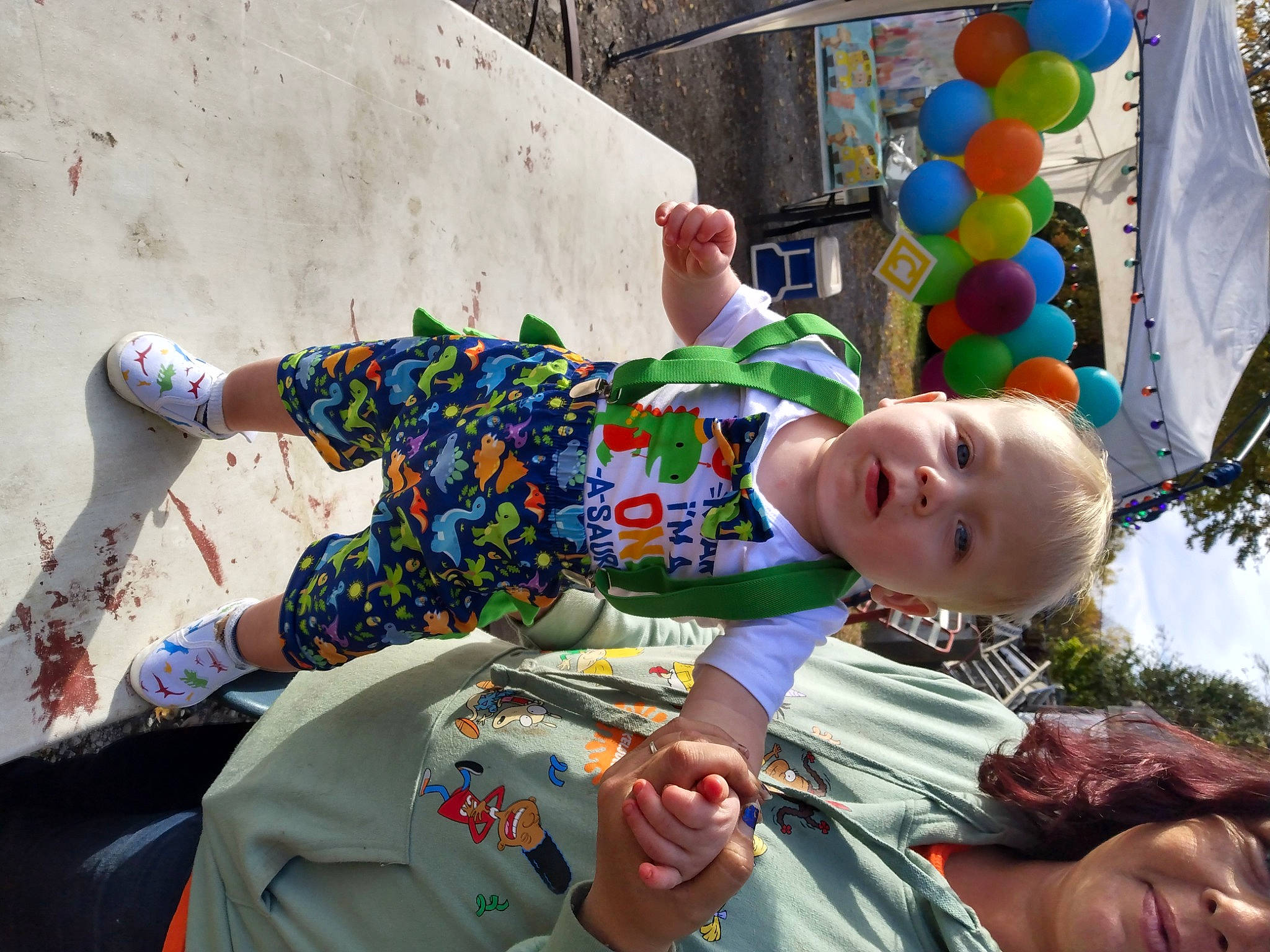 Allen is registered to the contest to win money with this photo: baby, balloon, child, eyewear, fun, grass, happy, leisure, party_supply, pattern, person, plant, play, recreation, sitting, smile, t_shirt, toddler, tree, vacation