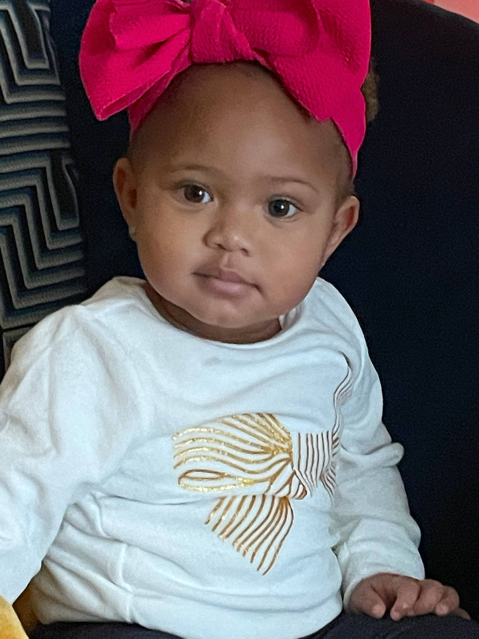 Naomi is registered to the contest to win money with this photo: baby, baby_toddler_clothing, bonnet, cheek, child, clothing, costume_accessory, costume_hat, ear, forehead, hair_accessory, headband, headgear, headpiece, lip, magenta, person, pink, skin, toddler