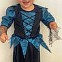 Mia a rejoint le concours — aidez-le/la à gagner de superbes lots ! child, toddler, costume, blue, black, dress, smiling, indoor, person, face, happy, short_hair, shoes, lace, floor, wall, playful, cute, portrait, standing