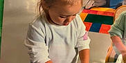 Mia participe au concours pour gagner de l'argent avec cette photo : activity, child, classroom, colorful, concentration, education, floor, hands, indoor, kids, learning, mold, playing, playtime, preschool, sand, table, toddler, toys, young