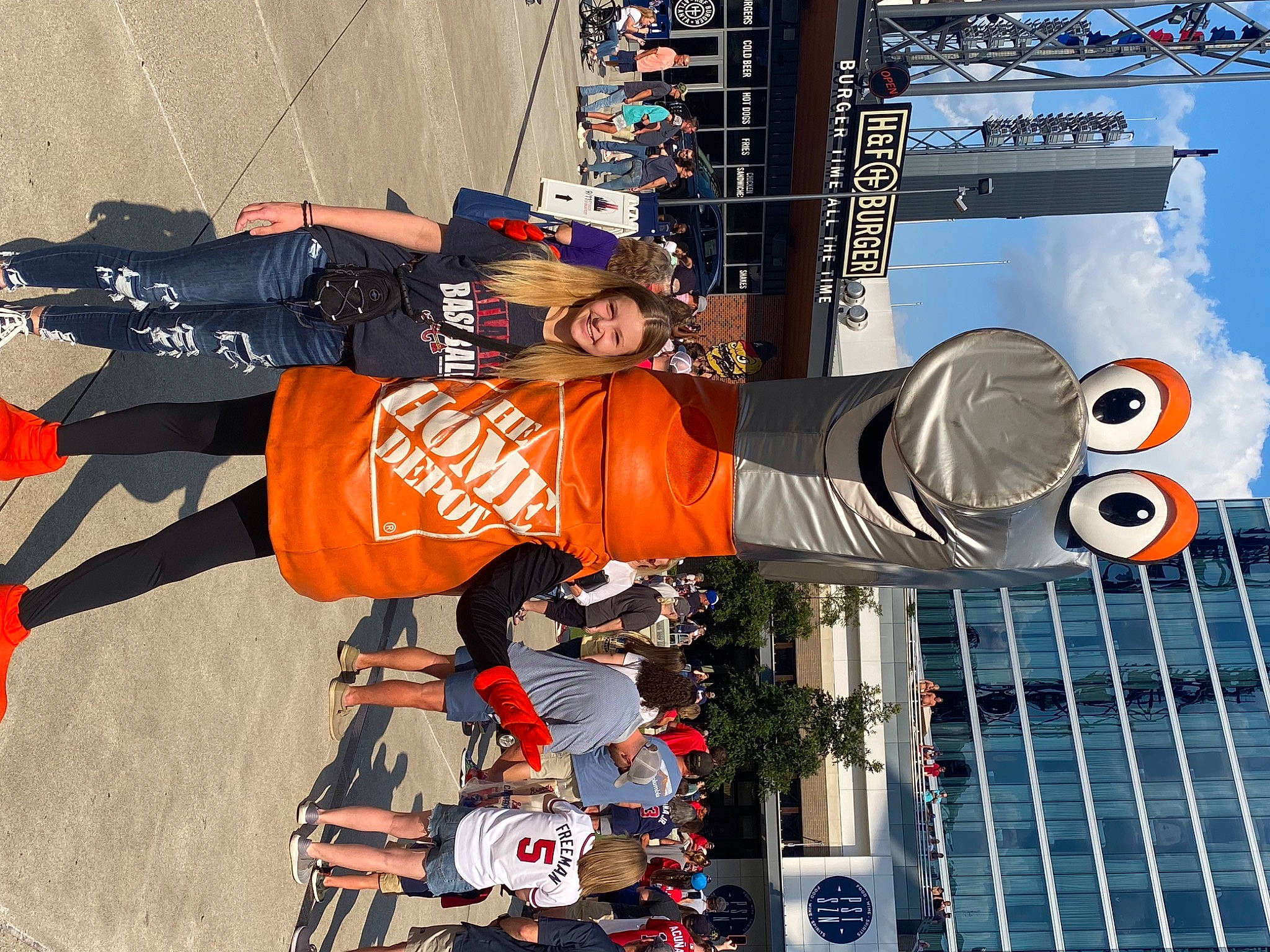 Lacie is registered to the contest to win money with this photo: advertising, building, engineering, glove, hat, headwear, jersey, joy, person, recreation, shorts, sky, smile, sports, sports_uniform, sportswear, stage_equipment, t_shirt, white, world