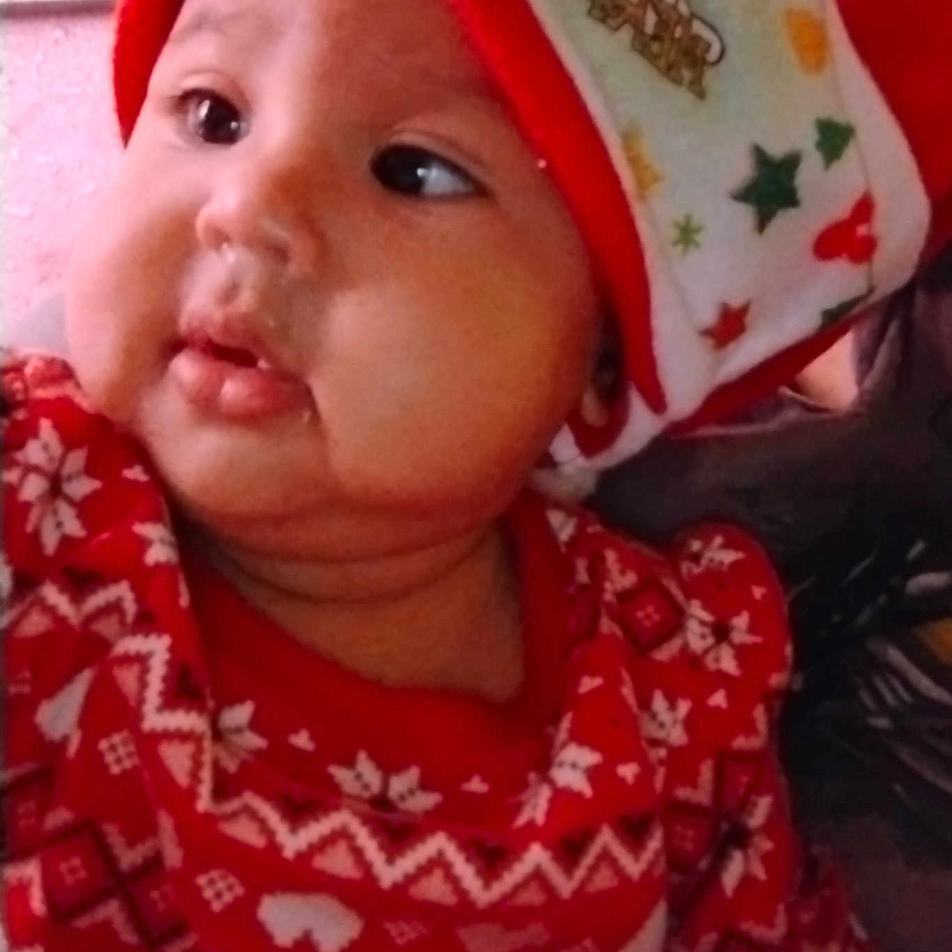 Island is registered to the contest to win money with this photo: baby, bonnet, cap, clothing, coat, face, happy, hat, head, hood, hoodie, jacket, knitwear, person, photography, portrait, selfie, smile, sweater, sweatshirt