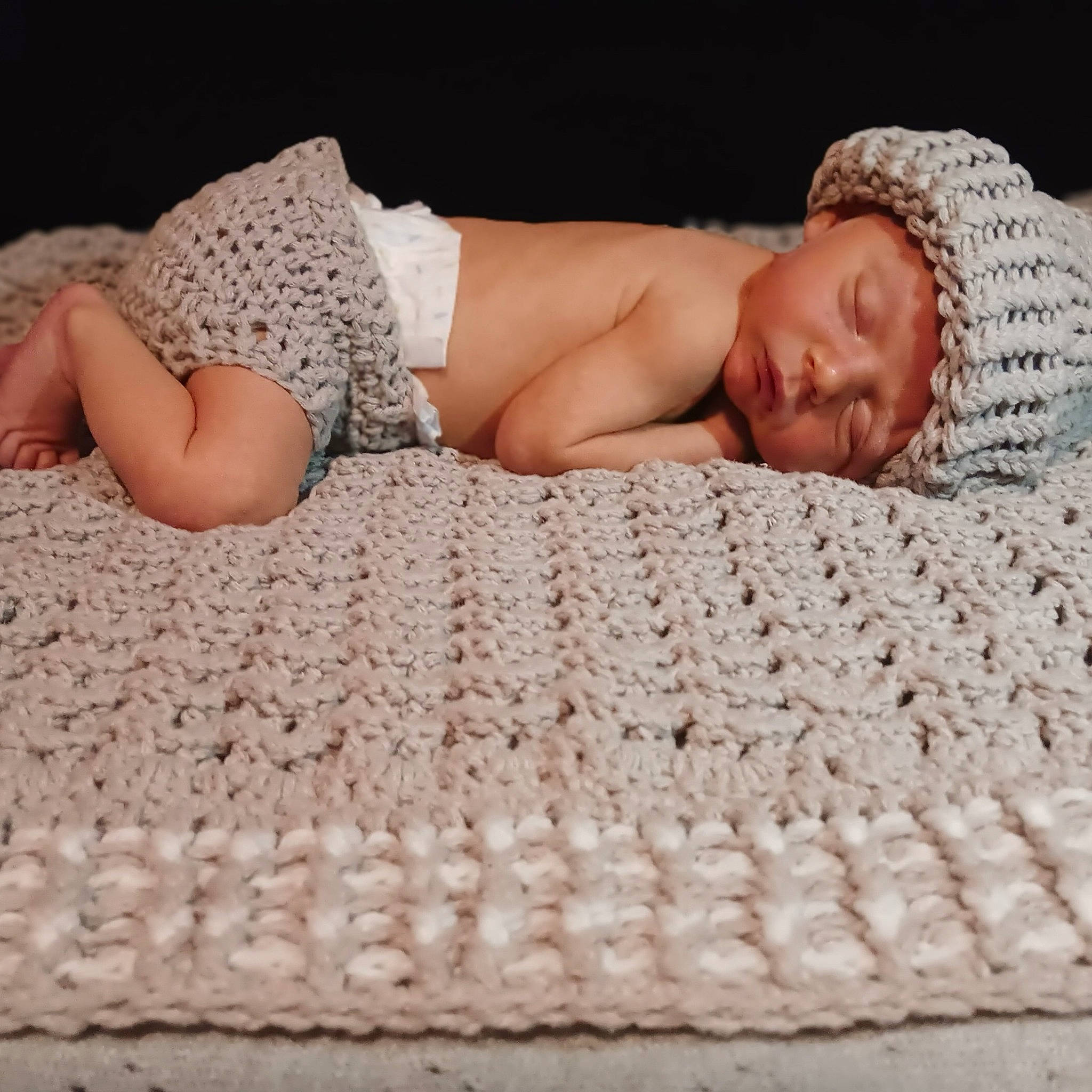 Silas is registered to the contest to win money with this photo: baby, baby_sleeping, baby_toddler_clothing, barefoot, bedding, child, comfort, fashion_accessory, flooring, headwear, human_leg, linens, nap, pattern, person, room, sitting, sleep, thigh, toddler