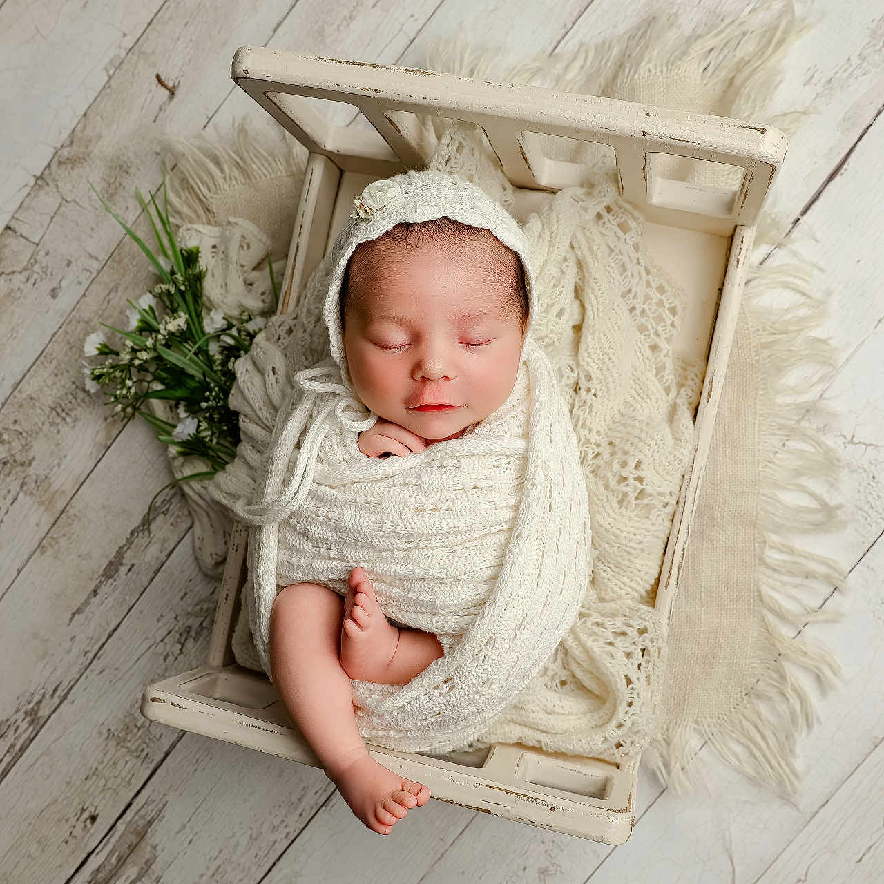 Charli joined the competition — help win amazing prizes! newborn, baby, sleeping, swaddled, knit_wrap, bonnet, wooden_crate, flowers, rustic, wooden_floor, cozy, peaceful, infant, portrait, soft_texture, cream_color, cute, resting, wrapped, adorable