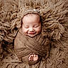 newborn, baby, smiling, wrapped, blanket, cozy, brown, knit, texture, fluffy, soft, sleeping, cute, infant, portrait, peaceful, foot, headwear, indoors, resting