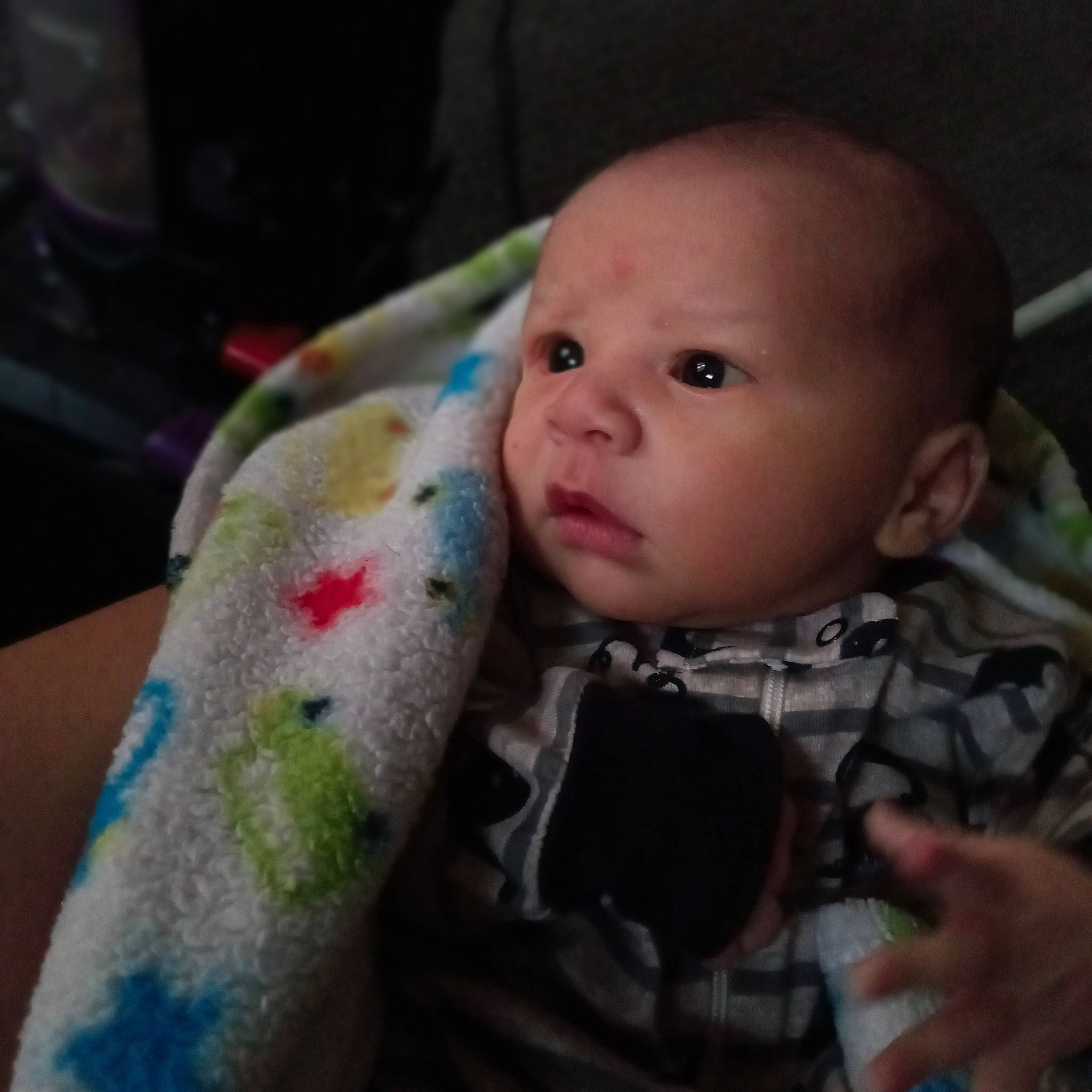 Kyran is registered to the contest to win money with this photo: baby, cheek, child, ear, eye, face, finger, hand, head, iris, lip, mouth, nose, person, sitting, skin, toddler