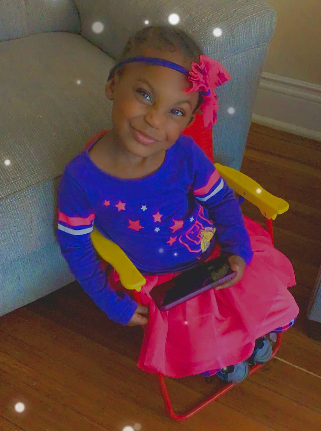 Vaniya Queen is registered to the contest to win money with this photo: baby_toddler_clothing, child, costume, electric_blue, event, flooring, fun, happy, hardwood, headwear, joy, leisure, magenta, person, personal_protective_equipment, pink, purple, room, sitting, sleeve