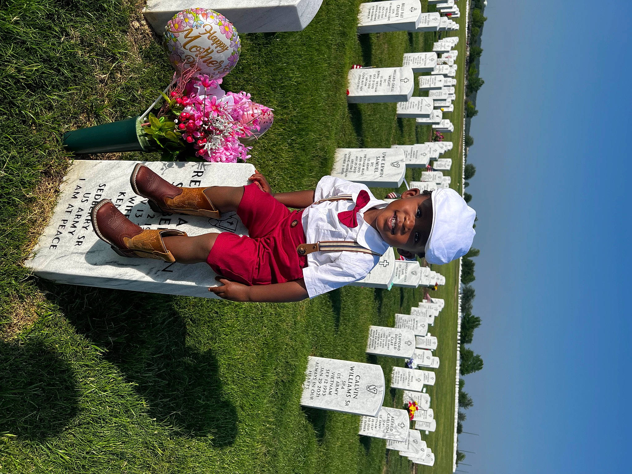 Reginald joined the competition — help win amazing prizes! cemetery, floral_design, flower, fun, grass, grave, groundcover, hat, headwear, house, leisure, person, petal, plant, recreation, shrub, sky, t_shirt, tree