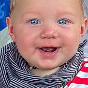 Colter joined the competition — help win amazing prizes! baby, infant, blue_eyes, smiling, close_up, cheeks, teething, bib, striped_clothing, hands, rings, holding, necklace, drool, portrait, indoor, furniture_in_background, head, hair, cute