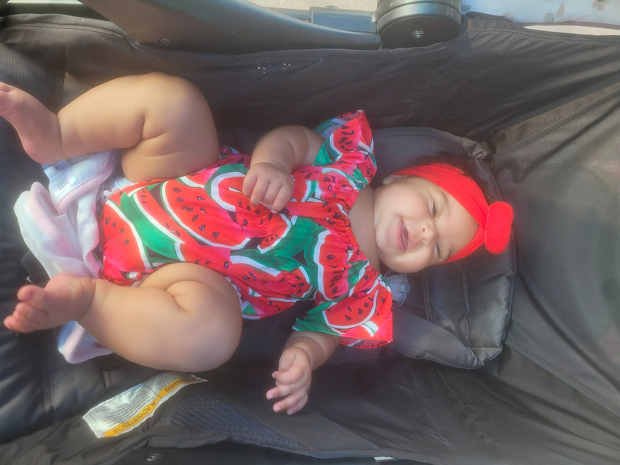 Mariah joined the competition — help win amazing prizes! baby, car_seat, chest, child, comfort, cool, facial_expression, fun, headwear, human_body, human_leg, knee, lap, leg, mammal, mouth, person, product, thigh, toddler