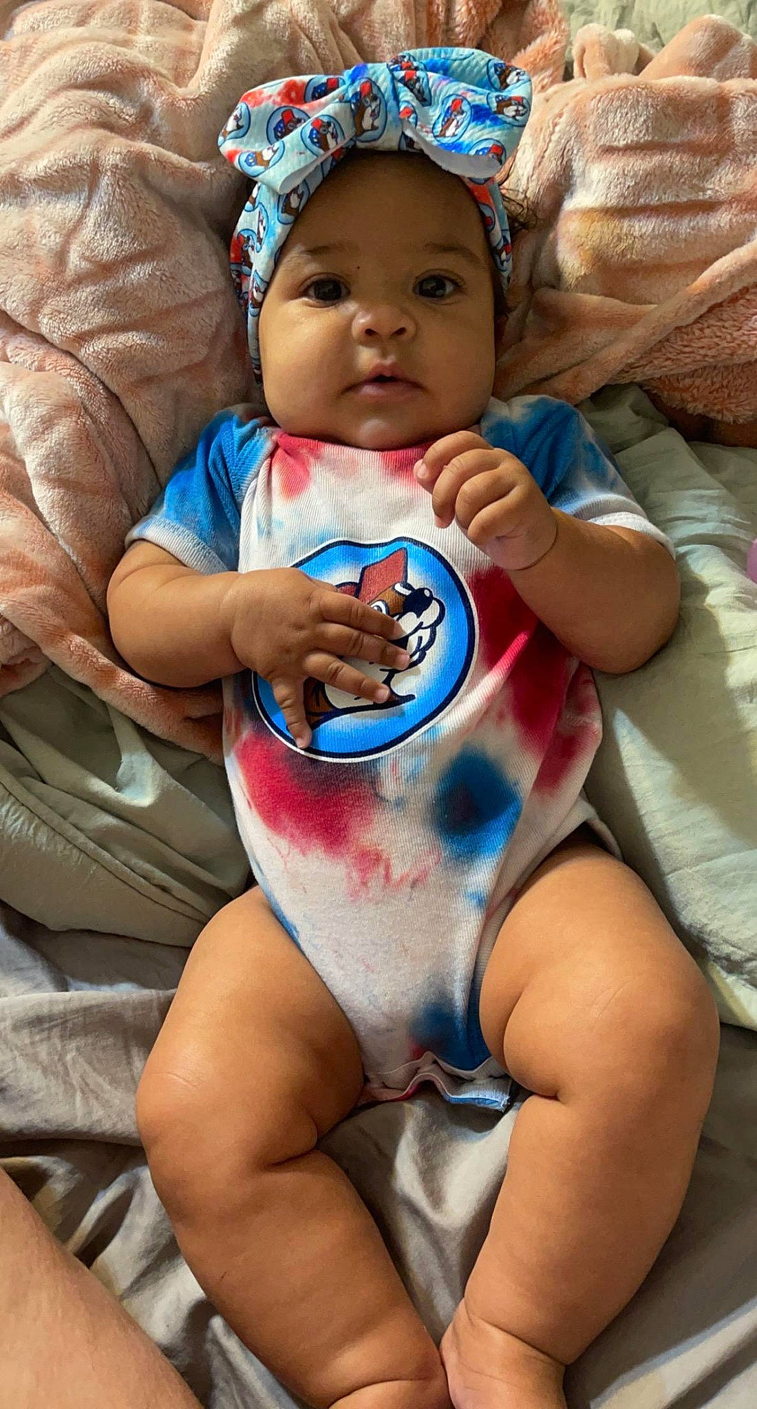 Mariah is registered to the contest to win money with this photo: abdomen, baby, baby_toddler_clothing, blue, chest, drinkware, eye, face, finger, happy, head, headwear, mouth, muscle, organ, person, skin, stomach, swimwear, thigh
