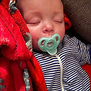 Kasun Eli joined the competition — help win amazing prizes! baby, infant, sleeping, pacifier, blanket, red_blanket, striped_onesie, onesie, closed_eyes, face, head, couch, soft_texture, cozy, newborn, peaceful, nap, fabric, portrait, closeup