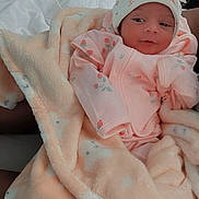 Aaliyah joined the competition — help win amazing prizes! baby, blanket, bed, clothing, face, hat, infant, person, pink, portrait, rest, sleepwear, soft, toddler, warm, wrapped, young, cute, newborn, cozy