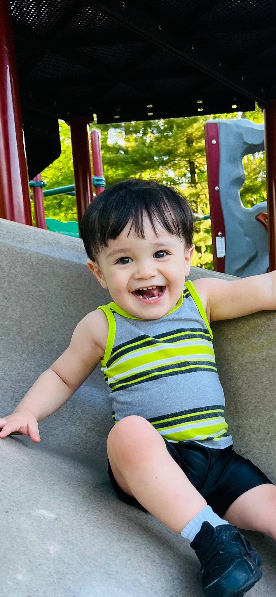 Jaden is registered to the contest to win money with this photo: baby_toddler_clothing, cheek, eye, face, finger, fun, hairstyle, happy, head, human_body, joy, leisure, person, photograph, product, public_space, shoulder, skin, sleeve, smile