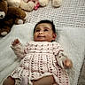 Julietta is registered to the contest to win money with this photo: baby, infant, child, portrait, lying_down, smiling, stuffed_animals, teddy_bear, doll, blanket, pink_outfit, knitted_clothing, nursery, bed, cuddly_toys, indoor, cozy, happy, date_stamp, photography