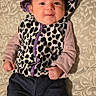 baby, child, infant, portrait, smiling, happy, lying_down, hooded_outfit, leopard_print, animal_print, purple, clothing, cushion, patterned_fabric, indoors, closeup, face, photography, date_stamp, cute
